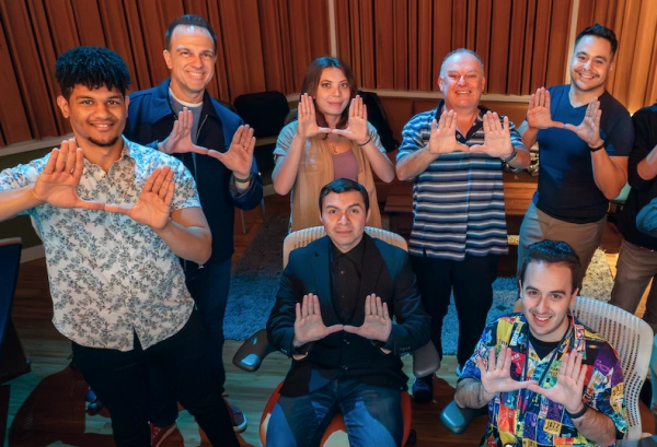 A group of students showing the U