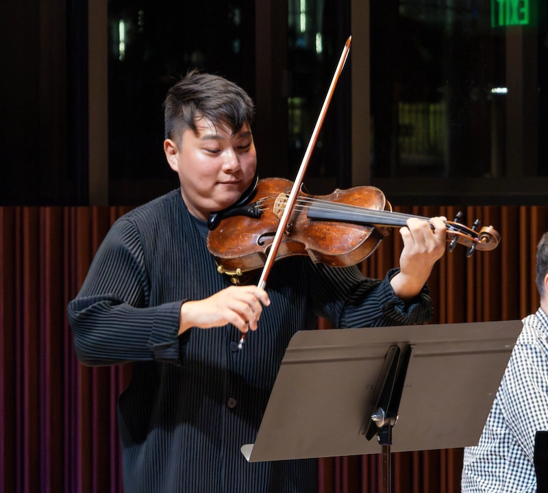 A student playing the violin