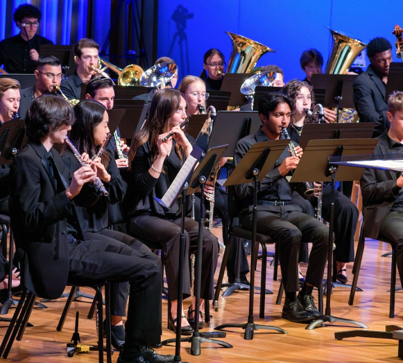 A group of students performing in an orchestra